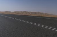 Dramatic Scenery in the UAE: Desert Road Leading to Mountains
