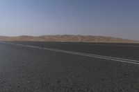 Dramatic Scenery in the UAE: Desert Road Leading to Mountains