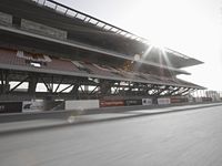 a photo taken from a distance, driving a race car on a track with an in turn checkered