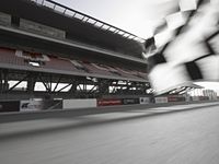 a photo taken from a distance, driving a race car on a track with an in turn checkered