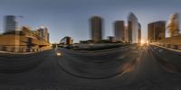 two blurred images of buildings and road with a city in the distance at dusk with city lights