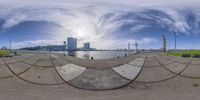 a 360 - ray view of a view from a beach of a waterway and buildings