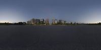 the view of the city skyline from across a runway at sunset time - 3d illustration