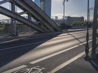 a bike lane and street name written in german on a bridge in the middle of the city