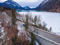 a view from above of an icy, cold valley and road over a highway on which is an open gorge