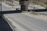 an elevated bridge on the side of a highway with cars and traffic on both sides