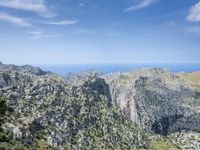 a mountain overlooks the mediterranean and ocean at one time, on this clear day