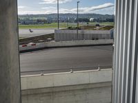 there is a view of an airport from a window on the road, from outside