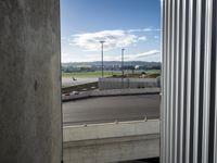 there is a view of an airport from a window on the road, from outside