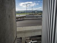 there is a view of an airport from a window on the road, from outside