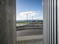there is a view of an airport from a window on the road, from outside
