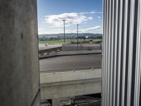 there is a view of an airport from a window on the road, from outside