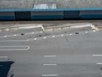 an empty lot with an empty parking lot in the background and clouds in the distance