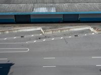an empty lot with an empty parking lot in the background and clouds in the distance