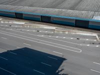 an empty lot with an empty parking lot in the background and clouds in the distance