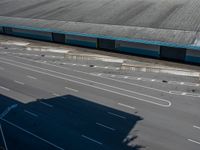 an empty lot with an empty parking lot in the background and clouds in the distance