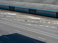 an empty lot with an empty parking lot in the background and clouds in the distance