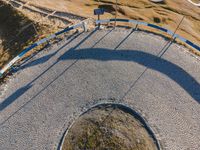 this is an image of a curved road and a sign that reads bj's and fs