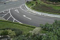 the road is narrow, but the markings are well marked in a shape of a curve