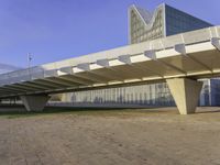 an elevated walkway over looking the city skyline at sunset is shown in this picture that features architecture