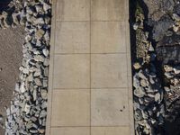 Elevated Wood Flooring with a Stone Wall