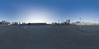 the panorama is of an empty airport, with many parked planes on the ground below