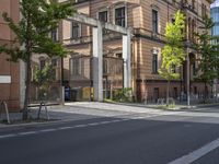 the street is empty of cars, motorcycles, and buildings in front of them in europe