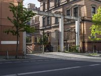 the street is empty of cars, motorcycles, and buildings in front of them in europe