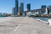 the bridge on a road looks empty in this urban setting with a city in the background