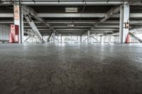 the view looking up from the inside of an empty building filled with concrete pillars and floors