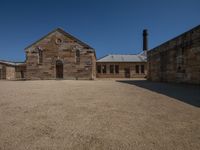 a building sits empty of people but it's surrounded by an empty courtyard area