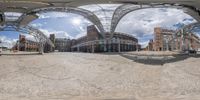 a big view of an empty building through a large spherical mirror of the day time