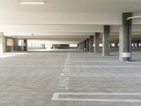 a empty building with signs in it's parking lot for pedestrians to use by