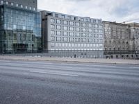 street in front of the building with an empty sign on it near an empty road