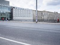 street in front of the building with an empty sign on it near an empty road