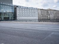 street in front of the building with an empty sign on it near an empty road