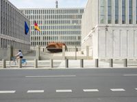 a couple of buildings sit empty in the foreground and a horse stands out behind it