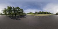 an image of an empty parking lot for cars to drive in it is a wide angle