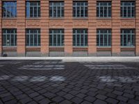 brick streets are filled with empty seats and chairs in the middle of them, a fire hydrant is visible