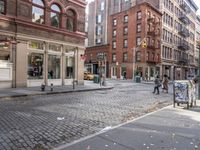 this is an image of a city corner, which looks to be empty and has trash bags scattered on the street