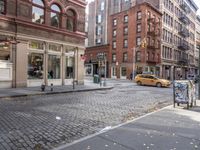 this is an image of a city corner, which looks to be empty and has trash bags scattered on the street