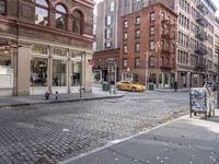 this is an image of a city corner, which looks to be empty and has trash bags scattered on the street