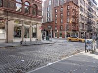 this is an image of a city corner, which looks to be empty and has trash bags scattered on the street