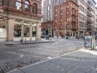 this is an image of a city corner, which looks to be empty and has trash bags scattered on the street