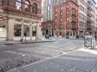 this is an image of a city corner, which looks to be empty and has trash bags scattered on the street