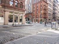 this is an image of a city corner, which looks to be empty and has trash bags scattered on the street