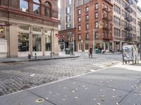 this is an image of a city corner, which looks to be empty and has trash bags scattered on the street