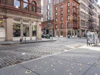 this is an image of a city corner, which looks to be empty and has trash bags scattered on the street