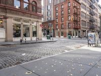 this is an image of a city corner, which looks to be empty and has trash bags scattered on the street