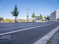 the empty city road is empty except for signs to tell you where to go and not to